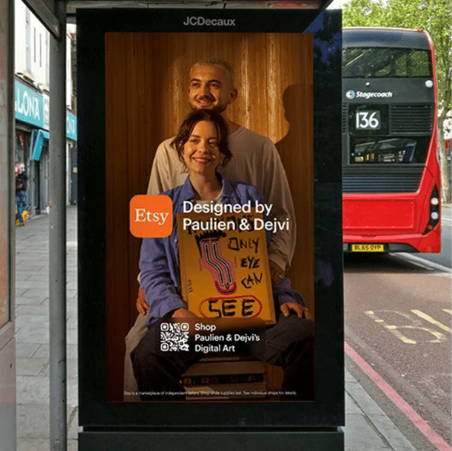 A bus stop with a poster on it Description automatically generated