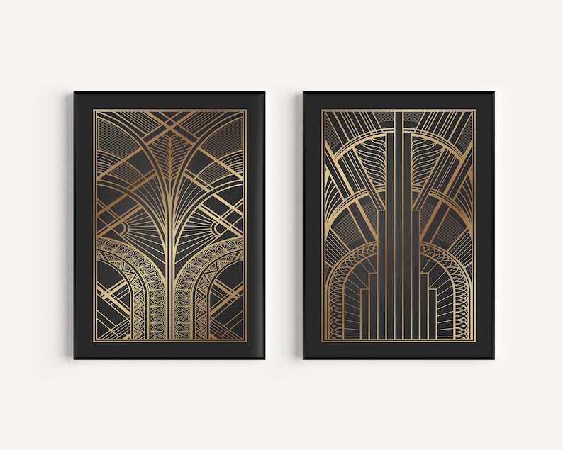 May include: Two black framed art prints with gold geometric designs. The designs are reminiscent of Art Deco style.